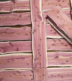 the wood has been cut into pieces and is pink with some brown streaks on it