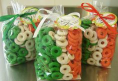 three bags filled with pretzels sitting on top of a counter