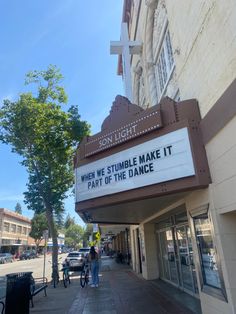 a marquee sign that reads when we stumble make it part of the dance