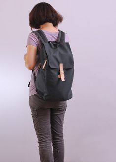 Backpack With Pockets For Commuting, Commuter Backpack With Pockets, Black Cotton Backpack For Everyday Use, Black Cotton Backpack With Pockets, Commuting Backpack With Pockets, Black Cotton Backpack For Daily Use, Functional Black Cotton Backpack, Rectangular Backpack With Functional Pockets For School, Practical Backpack For Back To School