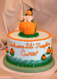 there is a cake that has been decorated with pumpkins on the top and bottom