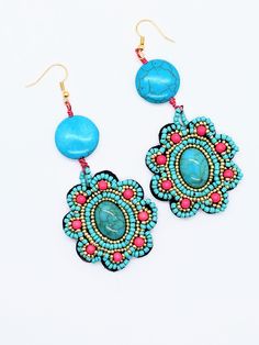 Bo Ho Southwest style Beaded Turquoise Earrings.  3" long dangle, 1.5" at the widest part.  Pretty turquoise blue Howlite gems adorned with pink and gold accent seed beads.  14K French Ear wire. Comes in a gift box and free same day USA shipping. TheBeadCougar World of Jewelry on Etsy, TheBeadCougar.etsy.com, specializes in fashionable, original, one of a kind, Biker, Skull, Religious and Southwest Jewelry along with vintage items, unique handcrafted home and kitchen accessories, all carefully m Traditional Turquoise Beaded Earrings, Artisan Turquoise Beaded Earrings With Ear Wire, Artisan Turquoise Beaded Earrings, Turquoise Beaded Southwestern Earrings, Handmade Turquoise Earrings For Festival, Festival Turquoise Earrings With Colorful Beads, Turquoise Earrings With Colorful Beads For Festival, Turquoise Dangle Flower Earrings, Turquoise Bohemian Beaded Earrings For Pierced Ears