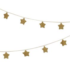 gold stars are hanging on a white string