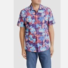 Enjoy Sunset Cocktails In This Tommy Bahama Islandzone Bahama Coast Techno Flora Camp Shirt In Black. This Bahama Coast Techno Flora Camp Shirt By Tommy Bahama Features Printed Recycled Polyester/Spandex Perforated Was Short Sleeve Coastal Collar With Slightly Curve Pocket Shirt Tail Hem. This Tommy Bahama Bahama Coast Techno Flora Camp Shirt Is Made Of 83% Recycled Polyester, 17% Spandex. Purple Short Sleeve Beach Top, Purple Summer Vacation Shirt, Purple Printed Shirt With Short Sleeves, Purple Short Sleeve Shirt For Vacation, Purple Short Sleeve Vacation Tops, Purple Short Sleeve Top For Vacation, Blue Floral Print Casual Short Sleeve Shirt, Purple Floral Print Short Sleeve Shirt, Summer Purple Button-up Shirt