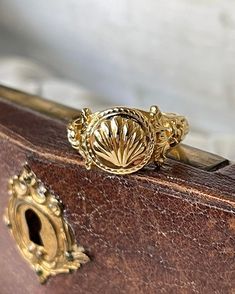 The Venus RIng is a beautiful ornate gold scallop ring. We celebrate the Goddess of Love with this ring. 18K Gold plated silver Venus Ring, Shell Design, Goddess Of Love, The Goddess, Gold Plated Silver, Cuff Bracelets, Of Love, Silver Plate, 18k Gold