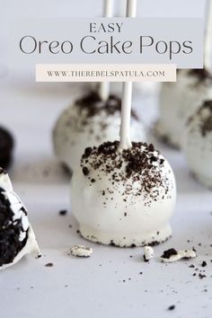 oreo cake pops with white frosting and chocolate sprinkles on top