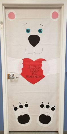 a door decorated to look like a polar bear holding a heart