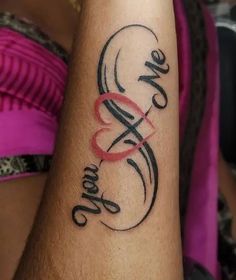 a woman's arm with a tattoo that says one love and two hearts on it