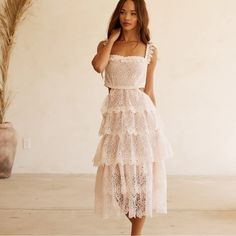 New! The Alana Lace Dress By Btb Los Angeles Comes In The Palest Shade Of Pinkcalled Petal. Constructed Of The Most Delicate Of Laces It Creates An Ethereal Silhouette. Perfect For Any Special Occasion Or Simply Adding A Touch Of Elegance To Your Everyday Wardrobe Enjoy All-Day Wear With Ease In This Luxe And Timeless Style. Length: 53.5 (Xs), 54 (S), 54.5 (M), 55 (L), 55.5 (Xl) Bust: 38 (Xs), 40 (S), 42 (M), 44 (L), 46 (Xl) Feminine Tiered Lace Dress, Feminine Tiered Lace Midi Dress, Chic Tiered Lace Summer Dress, Chic Summer Tiered Lace Dress, Sleeveless Lace Dress With Ruffles For Brunch, Feminine Lace Midi Dress For Day Out, Tiered Lace Dress For Brunch, Chic Sleeveless Lace Dress For Brunch, Long Sequin Dress