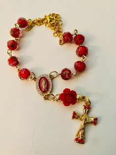 Handmade Car Rosary  Made with Beautiful Red Rose Transparent Glass Beads. Gold color crucifix and centerpiece with rhinestones. Lobster clasp for easy hanging. This Lovely Car Rosary will make a wonderful gift! Comes packaged in a jewelry gift box. Cheap Red Rosary Bracelet Gift, Cheap Red Rosary Bracelet As Gift, Cheap Red Rosary Bracelet For Gift, Car Rosary, Pocket Rosary, Lovely Car, Beautiful Red Roses, Lampwork Glass Beads, Religious Gifts