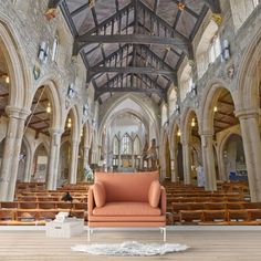 the interior of an old church with high vaulted ceilings and wooden pews on the floor