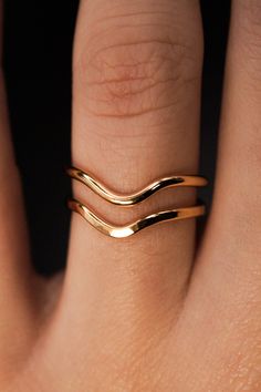 A curved arc stacking ring made from 14K Gold Fill Metal. After countless requests and some fine tuning, we finally perfected this ring shape! The Teardrop Ring stacks with all of our rings beautifully. It adds dimension to any stacking rings you wear daily but it also makes the perfect, low-key wedding band! The bend in the Teardrop Ring curves to hug a set stone beautifully if you are looking for a complimentary piece for your existing engagement ring. This listing is for ONE SINGLE RING.Made from 14K GOLD FILL metal.Available in a SMOOTH or HAMMERED texture. The smooth finish is fully round metal.Each ring measures approximately 1.75 mm in width. We recommend stacking the Teardrop Ring with the Pebble Ring, one of our favorite dimensional pieces inspired by precious stone rings but made Modern 14k Gold Curved Jewelry, Modern Curved 14k Gold Jewelry, Adjustable 14k Gold Double Band Ring, Adjustable Double Band 14k Gold Ring, Yellow Gold Minimalist Jewelry, Minimalist Yellow Gold Curved Jewelry, Minimalist Curved Yellow Gold Jewelry, Curved 14k Gold Jewelry For Anniversary, 14k Gold Curved Jewelry For Anniversary