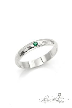 A simple emerald wedding band design with a luxurious hammered finish.  Natural gemstone in Yellow Gold. Rustic, vintage, modern and earthy Emerald Ring Band, Jewelry Party Ideas, Emerald Birthstone Jewelry, Symbol For Love, Emerald Band Ring, Emerald Wedding Band, Emerald Birthstone, Wedding Band Designs, Custom Wedding Band