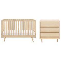 a baby crib and dresser with white sheets on the bottom, in front of a white background