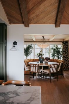 the dining room table is surrounded by chairs