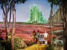 the wizard's castle is surrounded by flowers and trees, as well as two people