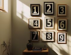 there are many framed numbers on the wall