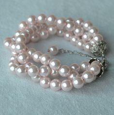 I make the bracelet to use 8mm pale pink glass pearls.The bracelet length is 8 inches ,It is fit to 6-7 inches wrist,IT has a 2 inches long adjustable chain.IT is good bracelet for your great wedding. I can make different type bracelet to your requirements,Please feel free to contact me if you have any question. Thank you so much. . The other pale pink jewelry: https://www.etsy.com/shop/glasspearlstore/search?search_query=pale+pink+&order=date_desc&view_type=list&ref=shop_search Pink Pearl Jewelry, Swarovski Pearls Bracelet, Pink Pearl Bracelet, Bride Bracelet, Grey Pearl Necklace, Pearl Bracelet Wedding, Black Pearl Necklace, Ivory Earrings, Glass Bead Bracelet