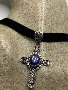 Brilliant dark raw Sapphire Lovely handmade silver work Low content Silver Over 2 inch long Hung on a black velvet ribbon that ties. Can hang on a chain All jewelry is shipped in a nice gift box. Check out our over a THOUSAND great reviews Silver Cross Pendant Jewelry For Party, Handmade Cross Necklace For Formal Occasions, Handmade Spiritual Jewelry For Formal Occasions, Distinctive Cross Jewelry For Gifts, Handmade Formal Cross Pendant Jewelry, Unique Cross Jewelry As Gift, Elegant Cross Pendant Jewelry For Party, Elegant Party Jewelry With Cross Pendant, Unique Cross Jewelry For Gifts