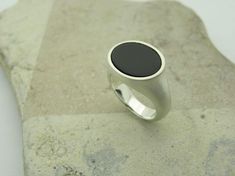 Elegant, simple silver ring with transversely aligned onix in oval flat table cut and beautiful dark black. Onix oval 12 x 16mm All ring sizes are available. Please write your ring size in the comment field by checking out. Minimalist Oval Cabochon Signet Ring For Formal Occasions, Minimalist Oval Cabochon Signet Ring For Formal, Modern Oval Cabochon Signet Ring For Formal Occasions, Modern Black Oval Signet Ring, Minimalist Onyx Oval Ring, Modern Black Oval Cabochon Ring, Onyx Silver Ring, Simple Silver Ring, Onyx Signet Ring