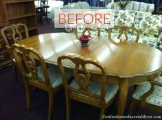 a wooden table with chairs around it in a room filled with couches and furniture