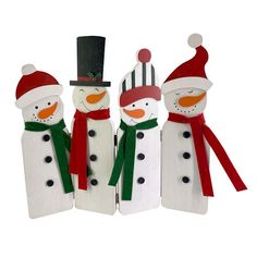 three snowmen wearing hats and scarfs standing next to each other