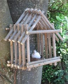 a bird house made out of wood sticks