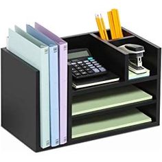 a black desk organizer with books, pencils and a calculator in it