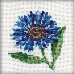 a blue flower with green leaves is shown in the cross stitch pattern on a white background