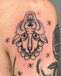 a man with a goat tattoo on his shoulder