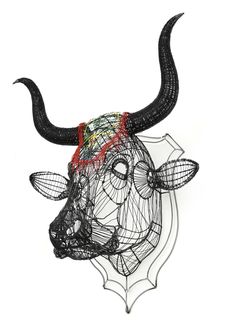 a wire sculpture of a bull's head on a white background