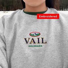 "*SIZES ARE UNISEX* -I'd suggest your usual size for a more fitted look, or sizing up for a more relaxed fit. *these sweatshirts are extra comfy when oversized 🎿 \"Vail Colorado\" embroidered on a comfy cute vintage-style crewneck. A sturdy and warm sweatshirt bound to keep you warm in the colder months. A pre-shrunk, classic fit sweater that's made with air-jet spun yarn for a soft feel and reduced pilling. Your new favorite sweatshirt! * 50% cotton, 50% polyester * Pre-shrunk * Classic fit wi College Winter Sweater With Embroidered Graphics, Winter College Sweater With Embroidered Graphics, Winter Sporty Sweatshirt With Embroidered Text, Sporty Sweatshirt With Embroidered Text For Winter, Sporty Winter Sweatshirt With Embroidered Text, Winter Sweater With Embroidered Logo And Relaxed Fit, Casual Winter Sweatshirt With Embroidered Text, Casual Crew Neck Sweater For Ski Season, Casual Winter Sweater With Embroidered Graphics