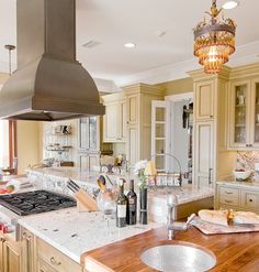 a large kitchen with an island and stove top