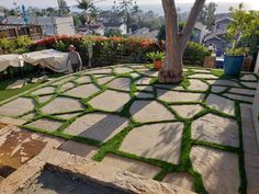 an outdoor patio with artificial grass on the ground