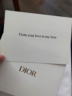 someone holding up two cards with the words from your love to my love