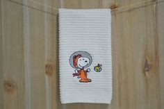 a towel hanging from a clothes line with a cartoon character on it