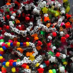 Get a lucky pick of 5 random MCR themed bracelets! Personalized Rave Beaded Bracelets As Gift, Personalized Rave Beaded Bracelet For Gift, Personalized Rave Beaded Bracelets For Gifts, Rave Style Jewelry With Letter Beads As Gift, Rave Style Jewelry With Letter Beads For Gift, Multicolor Novelty Wristband Bracelet, Novelty Bracelets With Letter Beads, Multicolor Novelty Bracelets For Party Favors, Personalized Multicolor Bracelets For Rave