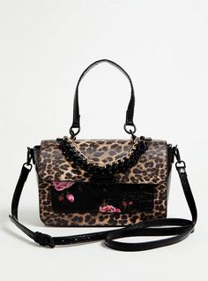 This satchel bag is looking pretty wild with its mixed prints (hello, leopard and roses). Features short and long straps for versatility, chain accents, and iconic Betsey Johnson touches. Turn-lock closure. 9. 5”L x 3. 75”W x 7. 5”H. 5. 5” handle drop . 58” Adjustable and removable crossbody strap. Inside pocket. Exterior slip pocket. Man-made materials. Imported. The best plus size women's betsey johnson leopard satchel bag handbags in multi made of pleather. Torrid is your destination for cozy Mixed Prints, Perfect Purse, Girly Bags, Girly Accessories, Beautiful Handbags, Black Purses, Cute Bags, Satchel Bag, Mixing Prints