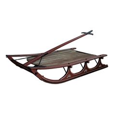 a wooden sled with two skis attached to it