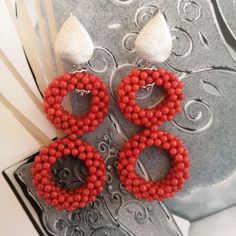 Coral earrings weaving. Red coral from the Mediterranean, the so-called Tessito process. This process is one of the most particular of the coral craftsmanship of Torre del Greco. Skilled threaders use for this weaving process coral pellets of about 2 millimeters in diameter and, with skill and skill, they manage to obtain often surprising pieces and shapes. The two coral woven circles are embellished by the rhodium-plated and satin-finished 925 silver lobe hook. Tessito coral red earrings are approximately 6 cm long. ------------------------- cammeoshop.etsy.com/it/ ------------------------- Quality Italian craftsmanship Cammeoshop jewels are all handcrafted. In my laboratory, the creations are designed and made with materials carefully chosen through continuous research and with the exper Cameo Earrings, Big Pearl, Italian Craftsmanship, The Coral, Coral Earrings, Weaving Process, Cameo Pendant, Coral Red, Red Earrings