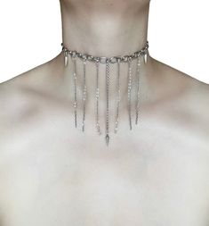 Pendulum Chain Choker 🖤 This unique necklace is made with a variety of silver chains in different thicknesses, creating texture. The dangling drop chains and pendulum charms add a touch of drama. 🖤 Only one available as I like to make one of a kind pieces so that you have a unique, standout, rare, special piece that you can't find anywhere else. Care Instructions: Keep your jewellery away from water, oils, perfumes and make sure to remove before showering and sleeping in order to keep it in it's best condition. Sphider Design Unique, Quirky, Alt, Grunge, Punk, handmade Silver Dangle Chain Choker, Silver Choker With Chain Pendant, Silver Dangle Charm Necklace, Silver Lariat Charm Necklace, Silver Chain Lariat Charm Necklace, Silver Drop Jewelry With Dangling Charms, Silver Double Chain Lariat Necklace, Silver Lariat Necklace With Double Chain, Metal Chain Dangle Choker