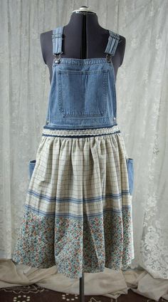 a dress made out of an old pair of jean overalls, with floral print on the bottom