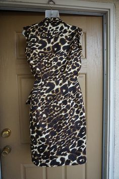 "Saks Fifth Avenue animal print dress. Fully lined. Labeled as a size 8 medium. In very good vintage condition! 18\" across front armpit to armpit 14.5\" across front of waist 37\" length" Sleeveless Brown Tiger Print Dress, Brown Sleeveless Tiger Print Dress, Cheetah Cat, Cat Print Dress, Black Tutu Skirt, Animal Jungle, Black Tutu, Animal Print Dress, Bathing Suit Covers