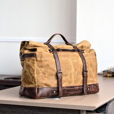 Waxed Canvas Duffel Bag Waterproof Canvas Travel Weekend Bag Carry on Weekender Overnight Bag For Mens This bag is made of waterproof oil wax canvas paired with crazy horse head layer cowhide. Your search for the perfect gift for him ends here. Our duffel bag is ideal for the on-the-go traveler. It has one exterior side pockets, a top pocket, and removable straps. The washed canvas and full grain leather make him look stylish wherever he goes next. Whether heading to the gym for a workout or hitting the road for an adventure, this canvas bag will be his next choice. Make it as unique as he is! Personalize this duffel bag with his name or initials for a special touch. Model Number: MC5166 Dimensions: 18.8"L x 7.8"W x 13.8"H / 48 cm(L) x 20 cm(W) x 35 cm(H) Weight: 3.3 lb / 1.5 kg Hardware: Waxed Canvas Duffle Bag, Vintage Travel Accessories, Weekend Duffle Bag, Canvas Duffel Bag, Canvas Duffle Bag, Waxed Canvas Bag, Leather Suspenders, Buy List, Travel Handbags