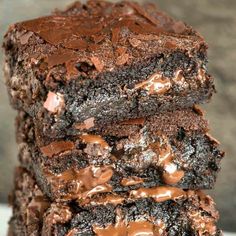 chocolate brownies stacked on top of each other