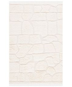 a white brick wall that has been made out of stone