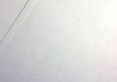 the ceiling is white and has water droplets on it