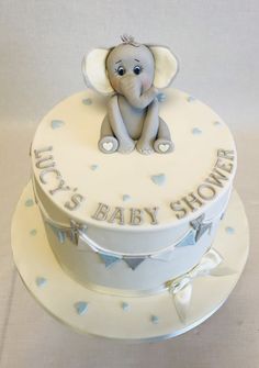 a baby shower cake with an elephant on top