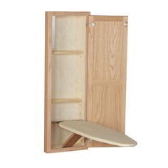 an open wooden cabinet with a surfboard in it