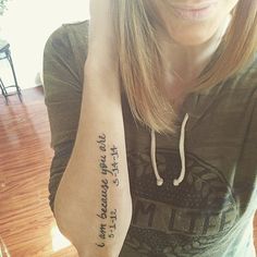 a woman with a tattoo on her arm and the words i love you to the moon and back